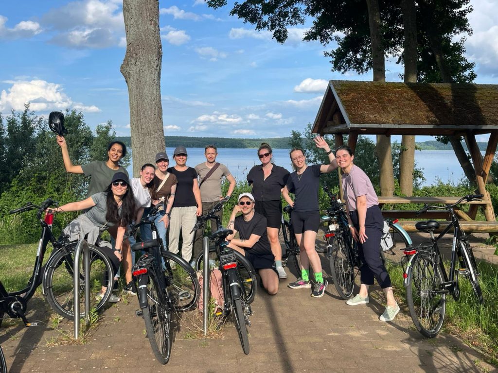 Expatrio-team-posing-for-pictures-with-bikes
